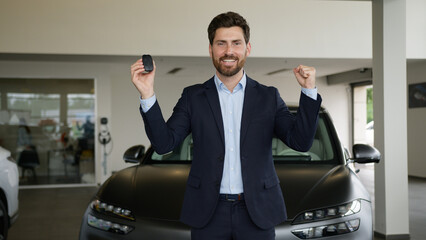 Happy excited Caucasian man businessman win new car owner buyer showing keys at camera buy automobile dealership joy male luxury auto credit business adult smile rent service successful guy customer