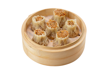 Chinese dim sum dumplings steamed shao-mai in a bamboo steamer.
