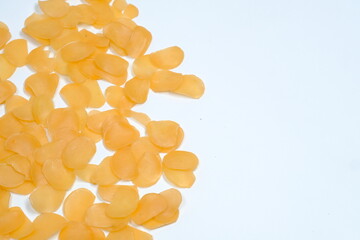 isolated white background original Indonesian raw crackers, uncooked crackers, usually used as an ingredient for making seblak