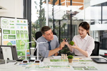Corporate officer workers collaborate in office Sustainable Development meeting , ESG and Business concept.