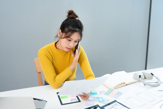 Female ux developer and ui designer , mobile app interface wireframe design. App developer working about screen display prototype layout for smartphone, ui, ux concept.