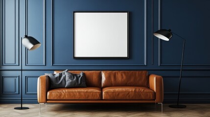 A brown leather sofa sits centered against a deep blue wall with paneling, flanked by floor lamps and a large blank framed canvas.  The floor is a light brown wood