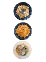 International food assortment in black bowl on white background.