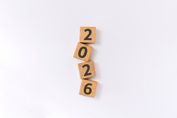 New year 2026 concept. 2026 written on wooden blocks arranged vertically. New year's resolution.