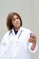 Transgender non binary doctor with stethoscope