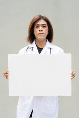 Transgender non binary doctor with stethoscope
