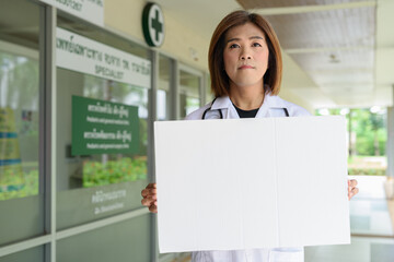 Transgender non binary doctor with stethoscope
