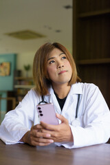 Transgender non binary doctor with stethoscope