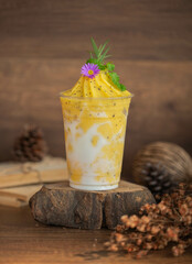 Passion Fruit Smoothie, a smoothie with alternating yellow and white colors and small black dots...