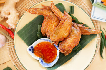  chicken wings fried until golden brown, crispy on the outside, soft on the inside, served with spicy dipping sauce or sweet chicken dipping sauce.