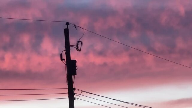 silhouette of a power pole