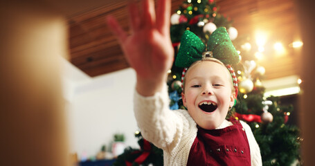 Christmas, surprise and happy child with gift box in low angle for festive celebration. POV, xmas...