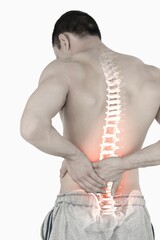 Highlighted spine of man with back pain
