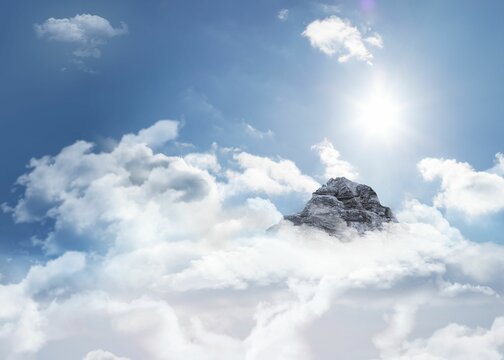 Fototapeta Mountain peak through the clouds