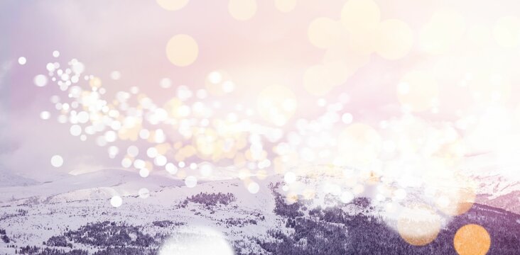Fototapeta Snowcapped mountains with bokeh in foreground