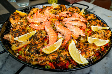 Spanish national dish Paella. Paella is typically prepared with rice, various types of meat or fish...