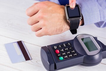 Man using smart watch to express pay