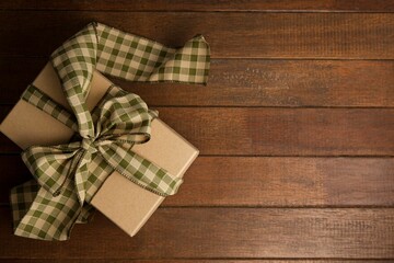 Overhead of gift box on wooden table
