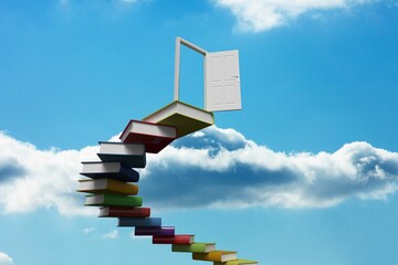 Obraz premium Book steps leading to door against sky