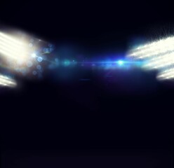 Horizontal band of blue and white lens flares is glowing over dark navy vector studio design
