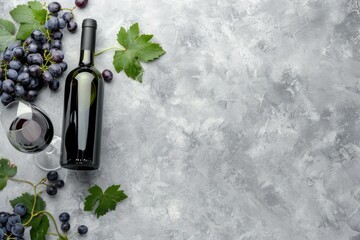 High Quality Image of Top View Wine Bottle and Glass with Grapes and Copyspace