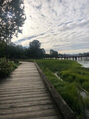 Wooden Boardwalk Along the Fraser River in South Vancouver’s River District, British Columbia
