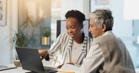 Laptop, collaboration and business women planning in office for insurance, training or help. Mature manager, computer and team in meeting for risk management, policy details and idea for proposal © peopleimages.com