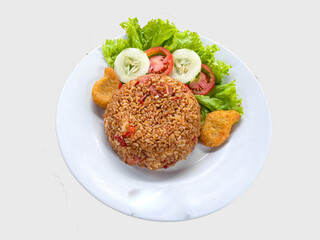 ried rice or nasi goreng is is a food made from fried rice originating from Asia served cucumber, sausage, nuggets, tomatoes. isolated on white background