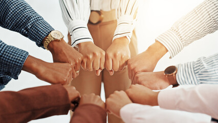 Business people, huddle and fist in circle with support, collaboration or team building. United,...