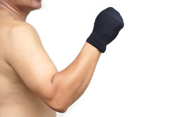 Close-up Thai male boxer’s clenched fists wrapped in black hand wraps. Concept strength, discipline, and readiness. Perfect for promoting fitness, Muay Thai training, or martial arts self-defense.