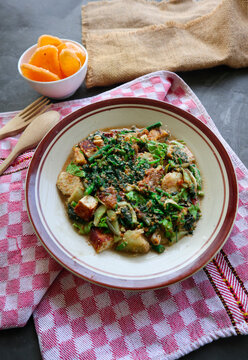 lotek is a traditional salad from Indonesia made from vegetable, chayote, kale, young jackfruit, tempeh, tofu, long beans, and bean sprouts with peanut sauce and cracker