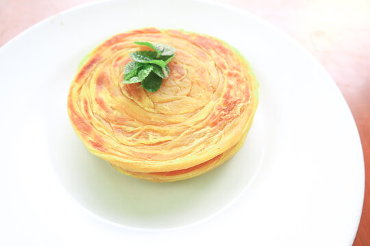 Roti Canai or Paratha Bread with Curry Sauce, Chilli Flakes and Yogurt, Top View