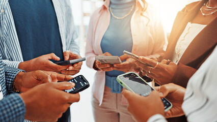 Business people, phone and hands in circle for networking, social media and sharing information at office. Group of employees, teamwork and mobile smartphone for app, online website or data sync