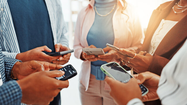 Business people, phone and hands in circle for networking, social media and sharing information at office. Group of employees, teamwork and mobile smartphone for app, online website or data sync - Powered by Adobe