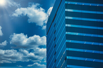 A cityscape of moving cloud reflecting the office building at the business town