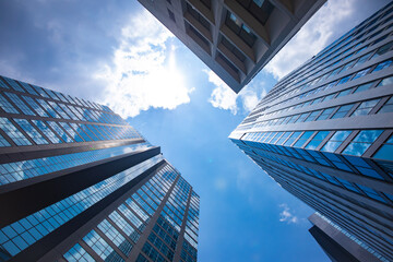 A cityscape of moving cloud reflecting the office building at the business town