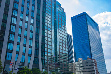 A cityscape of moving cloud reflecting the office building at the business town wide