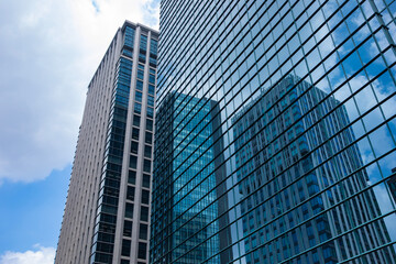 A cityscape of moving cloud reflecting the office building at the business town low