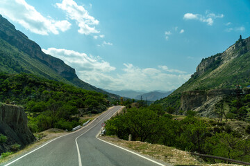 View from the car of an asphalt road in the mountainous area of Dagestan