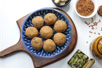 Gond and Methi Ke Laddu or Pinni. Fenugreek Laddu Made From Fenugreek Seeds, Saunf, Jaggery, and nuts. Immunity booster food for winters. Copy space