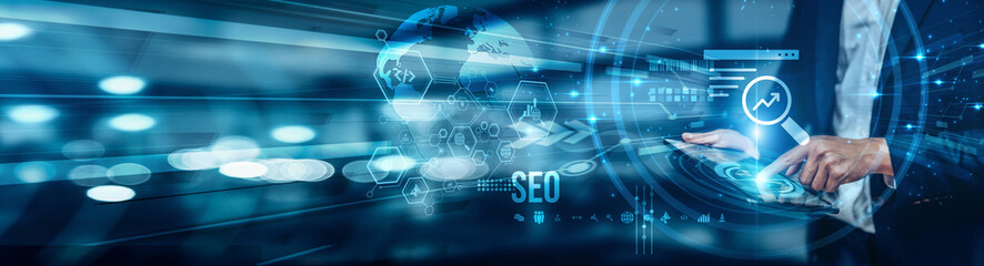 A businessman using a tablet is analyzing SEO by leveraging tools like SEMrush and SE Ranking to...