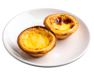 Two delectable golden Portuguese egg tarts with flaky pastry shells rest invitingly on a clean plate