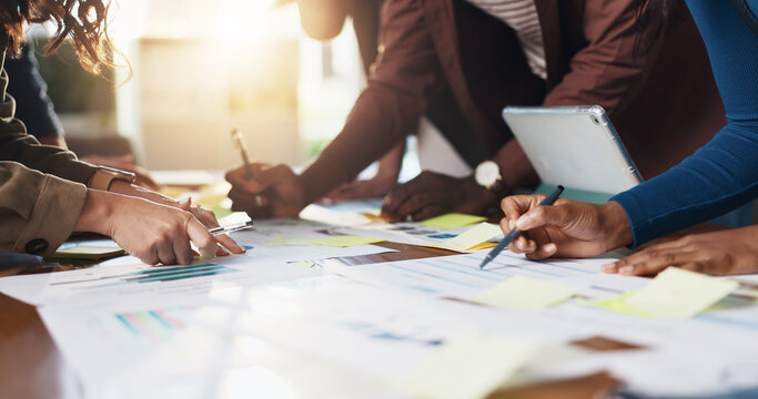 Collaboration, hands and paper with business people in office boardroom for meeting or planning. Information, marketing and strategy with employee team in workplace for chart, data or graph review