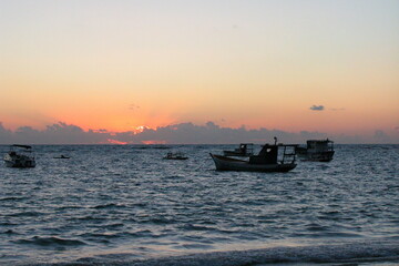 Boats on the water at sunset