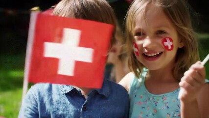 Happy Children with Swiss Flag Face Paint on National Day