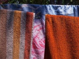 Colorful Towels Hanging to Dry in Sunlight