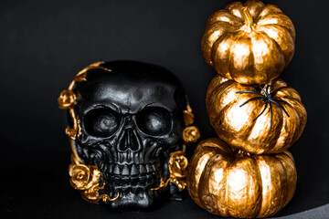 Halloween celebration. Black skull with golden roses and pumpkins. Decor for the Day of the Dead or...