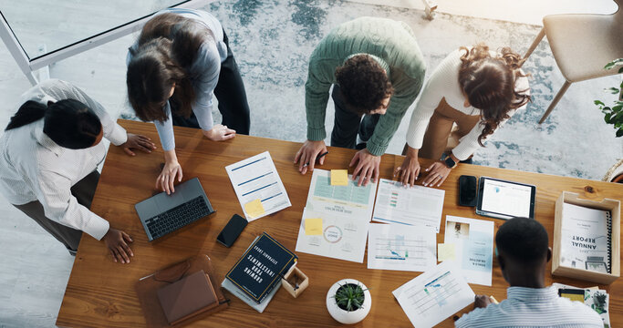 Documents, technology and team of business people in office with planning for investment growth. Paperwork, discussion and group of financial advisors with statistics for profit report from above. - Powered by Adobe