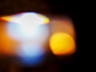 Colorful light leaks on black background for design and special effects. Retro film look. Abstract...