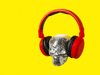 Party scull made of small mirrors wearing red colorful headphone. Abstract super DJ concept. Fan of...